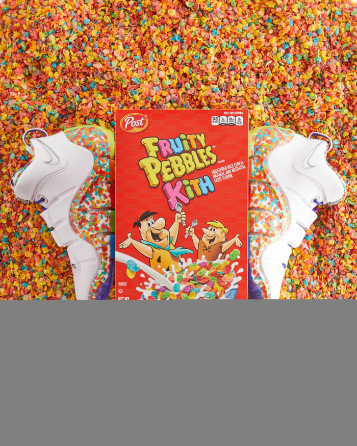LeBron James' white Nike sneakers next to a Fruity Pebbles cereal box.